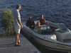 A screenshot of security video showing Linda O’Leary, wife of celebrity investor Kevin O’Leary, driving their speedboat to a neighbour’s cottage on the evening of a fatal boat crash. Kevin is in a black shirt, Linda in blue jeans and a white top and Allison Whiteside, an O’Leary family friend, is in red top.