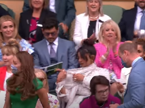 Priyanka Chopra, centre, adjusts her scarf as Kate and Prince William enter the Royal Box at Wimbledon.