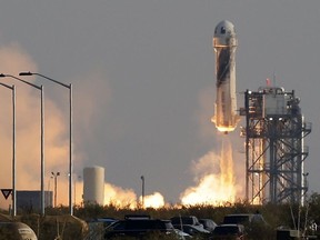 Billionaire businessman Jeff Bezos is launched with three crew members aboard a New Shepard rocket on the world's first unpiloted suborbital flight from Blue Origin's Launch Site 1 near Van Horn, Texas , U.S., July 20, 2021.
