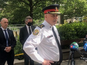 Toronto Police Chief James Ramer, joined by Toronto Police Association President Jon Reid, left, and Mayor John Tory outside Toronto CIty Hall on Friday, July 2 2021