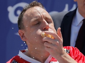 Joey Chestnut competes during Nathan's Famous Fourth of July Hot Dog-Eating Contest held at Maimonides Park in New York City, New York, U.S., July 4, 2021.
