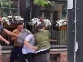 A wild street brawl, that may have been racially motivated, outside the Toronto Queen Street pub the Dog & Bear during the Euro Final last Sunday afternoon, was captured on video and posted on social media.