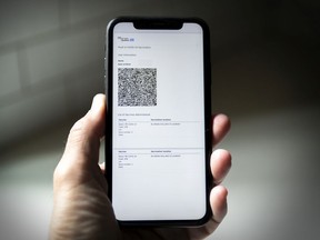 A cellphone displays a QR code proof of vaccination sent to Quebecers who have been vaccinated against COVID-19.