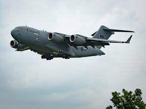 A Royal Canadian Air Force C-17 Globemaster roars in for a landing at Toronto Pearson International Airport in Toronto earlier this month. The military cargo plane was the second airlift mission evacuating Canadian Forces contracted interpreters out of Afghanistan.