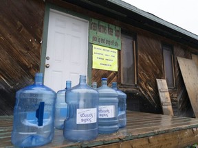Water bottles are seen at the local water supply site on the Grassy Narrows First Nation, in northwestern Ontario, Saturday, Oct. 5, 2019. After six decades of suffering the effects of a mercury contamination in the English-Wabigoon River in northwest Ontario, Grassy Narrows is hoping more funding for a treatment home the federal government promised to build will provide long-term care for hundreds battling chronic health problems.