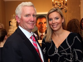 Bruce Anderson, chairman of polling firm Abacus Data, with his daughter, Kate Purchase, then director of communications for Prime Minister Justin Trudeau, at a holiday party that U.S. Ambassador Bruce Heyman and his wife, Vicki, hosted on December 8, 2015.