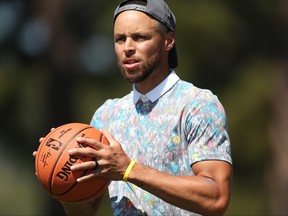 NBA player Steph Curry shoots a basketball on the 17th hole during round one of the American Century Championship at Edgewood Tahoe South golf course on July 9, 2020 in South Lake Tahoe, Nevada.
