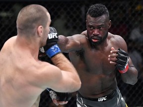In this handout image provided by UFC, (R-L) Uriah Hall of Jamaica punches Sean Strickland in a middleweight fight during the UFC Fight Night event at UFC APEX on July 31, 2021 in Las Vegas, Nevada.