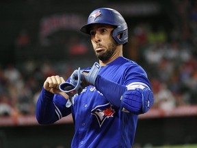 Blue Jays’ George Springer reacts to fans booing him after a ground out against the Angles on Thursday.