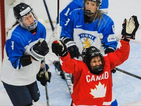 Canada’s Jamie Rattray celebrates after her teammate Marie-Philip Poulin scored against Finland at the IIHF women’s world championship Group A match played at WinSport Arena in Calgary last night.
