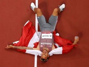 Andre De Grasse of Team Canada celebrates after winning the gold medal in the Men's 200m Final on day twelve of the Tokyo 2020 Olympic Games at Olympic Stadium on August 04, 2021 in Tokyo, Japan.