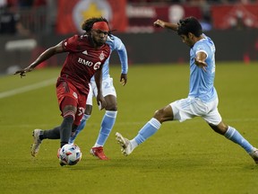 New York City FC midfielder Andres Jasson tries to stop Toronto FC forward Ifunanyachi Achara during their match last week.