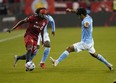 New York City FC midfielder Andres Jasson tries to stop Toronto FC forward Ifunanyachi Achara during their match last week.