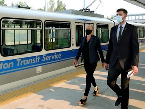 Minister of Infrastructure and Communities Catherine McKenna and Mayor Don Iveson arrive at a press conference where McKenna announced priority funding consideration is being made for the Edmonton Capital Line South Extension, Tuesday July 27, 2021.