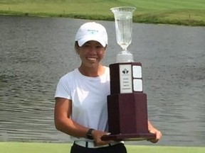 Jasmine Ly poses with the trophy after winning the Ontario Women’s Amateur tournament.