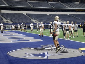 The New Orleans Saints participate in an NFL football workout at AT&T Stadium in Arlington, Tex., on Monda.
