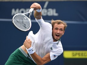 Daniil Medvedev of Russia serves against Alexander Bublik of Kazakhstan in second round play in the National Bank Open at Aviva Centre.