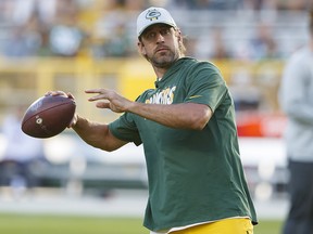 Green Bay Packers quarterback Aaron Rodgers throws a pass during warmups prior to a game against the Houston Texans at Lambeau Field.