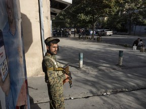 Kabul police secure areas in the central part of the city on Aug. 13, 2021 in Kabul, Afghanistan.
