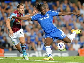 Chelsea's Belgian striker Romelu Lukaku (R) vies with Aston Villa's Dutch defender Ron Vlaar (L) during the English Premier League football match between Chelsea and Aston Villa.