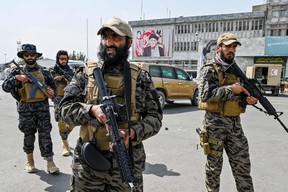 Members of the Taliban Badri 313 military unit arrive at the airport in Kabul on August 31, 2021, after the U.S. has pulled all its troops out of the country to end a brutal 20-year war — one that started and ended with the hardline Islamist in power.