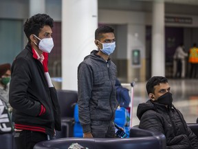 Students from India at the International Arrivals at Terminal 1 at Toronto Pearson International Airport are pictured in this file photo taken on Dec. 27, 2020.