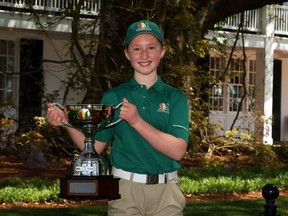 Alexis Card, of Cambridge, Ont., poses with the trophy after winning the 7- 9-year-old division of the Drive, Chip and Putt Championship at Augusta National in April.
