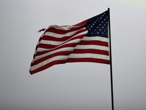 An American flag is seen at a beach volleyball tournament in Atlanta, Aug. 14, 2021.