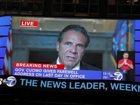 A farewell speech by New York Governor Andrew Cuomo is broadcast live on a screen in Times Square on his final day in office in New York City, Monday, Aug. 23, 2021.