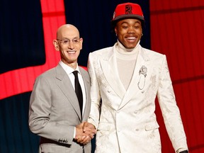 NBA commissioner Adam Silver (left) and Scottie Barnes pose for photos at the 2021 NBA Draft