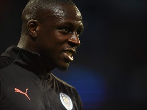 In this file photo taken on Oct. 22, 2019, Manchester City's French defender Benjamin Mendy warms up for the UEFA Champions League Group C football match between Manchester City and Atalanta at the Etihad Stadium in Manchester, northwest England.