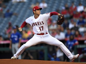 Shohei Ohtani  of the Los Angeles Angels throws against the Toronto Blue Jays at Angel Stadium of Anaheim on August 12, 2021 in Anaheim, California.