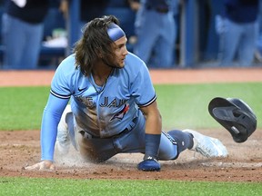 Blue Jays shortstop Bo Bichette slides home to score against the Chicago White Sox in the sixth inning at Rogers Centre on Monday, Aug. 23, 2021.