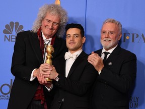 Rami Malek poses with Queen members Roger Taylor (right) and Brian May (left) during the 76th annual Golden Globe Awards on January 6, 2019, at the Beverly Hilton hotel in Beverly Hills.