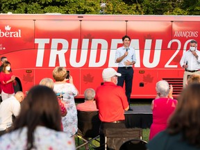 Liberal Leader Justin Trudeau speaks to a crowd as someone takes a photo in front of his campaign bus during the 2021 election as he visits the riding of Malpeque in Cornwall, Prince Edward Island, August 22, 2021.
