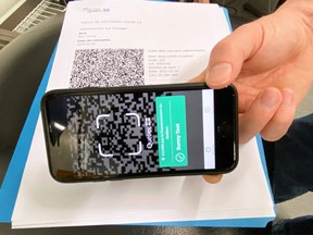 A test scan of a vaccine passport is shown at an Econofitness gym in Laval, Que., Aug. 17, 2021.