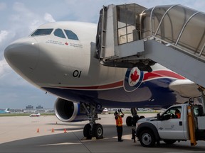 A Canadian Armed Forces CC-150 Polaris aircraft carrying Afghan refugees who supported Canada’s mission in Afghanistan arrives at Toronto Pearson International Airport in Mississauga, Aug. 13, 2021.