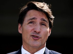 Prime Minister Justin Trudeau speaks to media following a meeting with Governor General Mary Simon at Rideau Hall in Ottawa, on Sunday, Aug. 15, 2021.