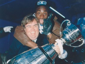 John Candy carries Raghib Ismail on his back and the Grey Cup -- which the Argos won in 1991 -- in his arms.