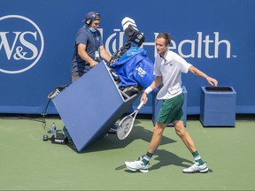 Daniil Medvedev runs into the TV camera during his match against Andrey Rublev (not pictured) in their semifinal match during the Western and Southern Open at the Lindner Family Tennis Center in Mason, Ohio, Aug. 21, 2021.