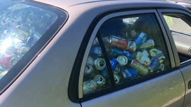 Car stopped at RIDE spotcheck full to the brim with empty beer cans