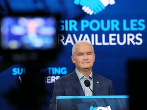 Conservative Party of Canada leader Erin O'Toole listens to a reporter's question during a news conference on Aug. 23, 2021 in Ottawa.