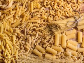 Variety of types and shapes of dry pasta.