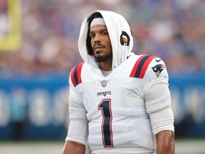 New England Patriots quarterback Cam Newton (1) looks on during the first half against the New York Giants at MetLife Stadium.