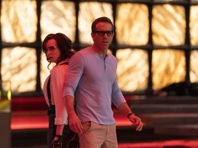Jodie Comer as Molotov Girl and Ryan Reynolds as Guy in 20th Century Studios’ Free Guy.