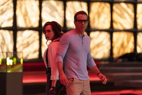 Jodie Comer as Molotov Girl and Ryan Reynolds as Guy in 20th Century Studios' Free Guy.