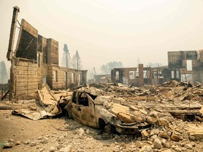 A destroyed hotel smolders during the Dixie fire in a decimated downtown Greenville, California on August 5, 2021.