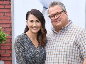 Eric Stonestreet and partner Lindsay Schweitzer walk the carpet at the 'The Secret Life of Pets 2' Los Angeles Premiere at Regency Village Theatre in Westwood, Calif., on June 2, 2019.