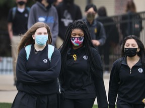 Students from DeLaSalle High School participate in a statewide school walkout to draw attention to the recent deaths of Daunte Wright and Adam Toledo at the hands of police on April 19, 2021 in Minneapolis, Minnesota.