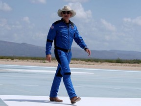 Jeff Bezos walks near Blue Origin’s New Shepard after flying into space on July 20, 2021 in Van Horn, Texas.